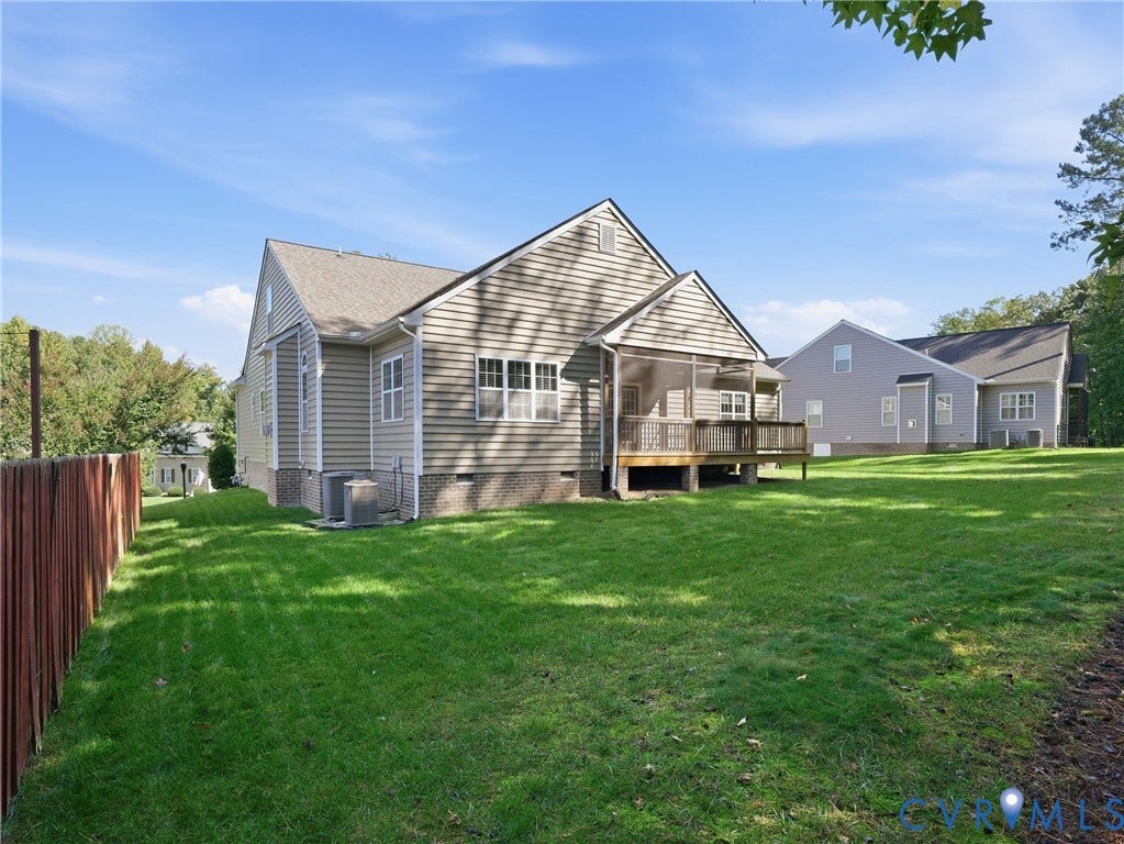 11037 Vogel Court, Bellshire, North Chesterfield, VA 23236 Rear exterior featuring horizontal lap siding, a screened-in porch with wood-style decking, and a fenced backyard