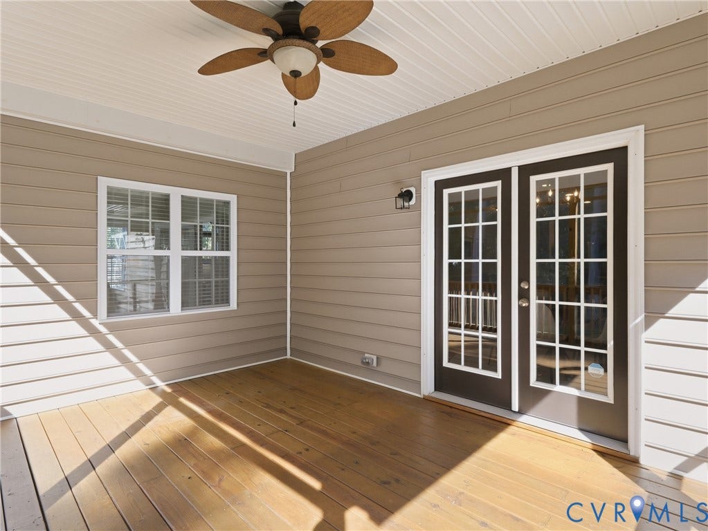 11037 Vogel Court, Bellshire, North Chesterfield, VA 23236 Covered patio featuring wood decking, horizontal lap siding, French doors with glass panes, a multi-blade ceiling fan, and a single-light exterior wall sconce