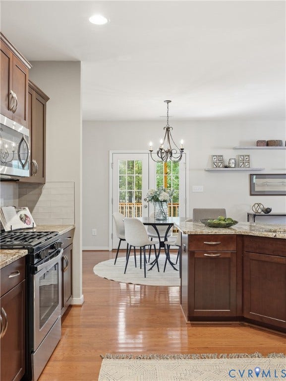 11037 Vogel Court, Bellshire, North Chesterfield, VA 23236 Kitchen featuring wood-finish cabinetry, stone countertops, stainless steel appliances, wood-finish flooring, and a decorative chandelier