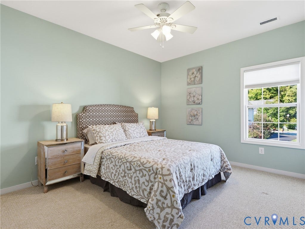 11037 Vogel Court, Bellshire, North Chesterfield, VA 23236 Neutral-toned wall finish, wall-to-wall carpeting, single-hung window with a white frame, and a white ceiling-mounted fan with integrated lighting
