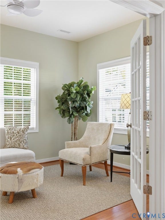 11037 Vogel Court, Bellshire, North Chesterfield, VA 23236 Room featuring double-paned windows, white-trimmed French doors, wood-finish flooring, and a ceiling-mounted light fixture