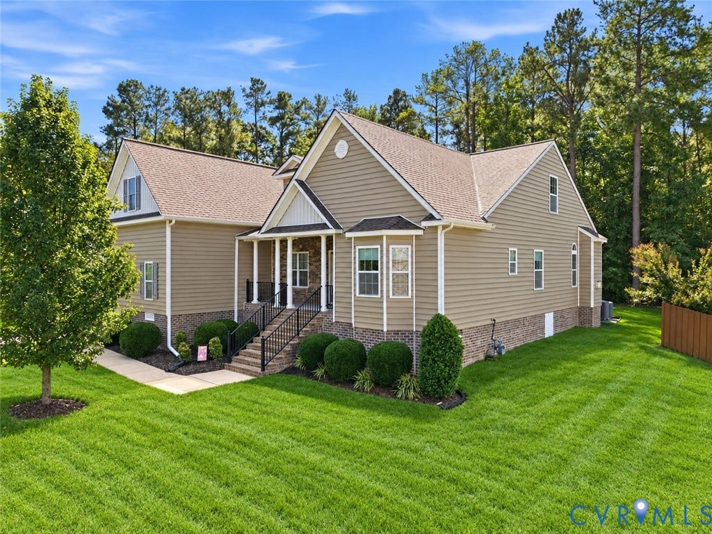 11037 Vogel Court, Bellshire, North Chesterfield, VA 23236 Multi-gabled exterior featuring horizontal siding, stone veneer foundation, covered front porch with iron railings, and concrete walkway