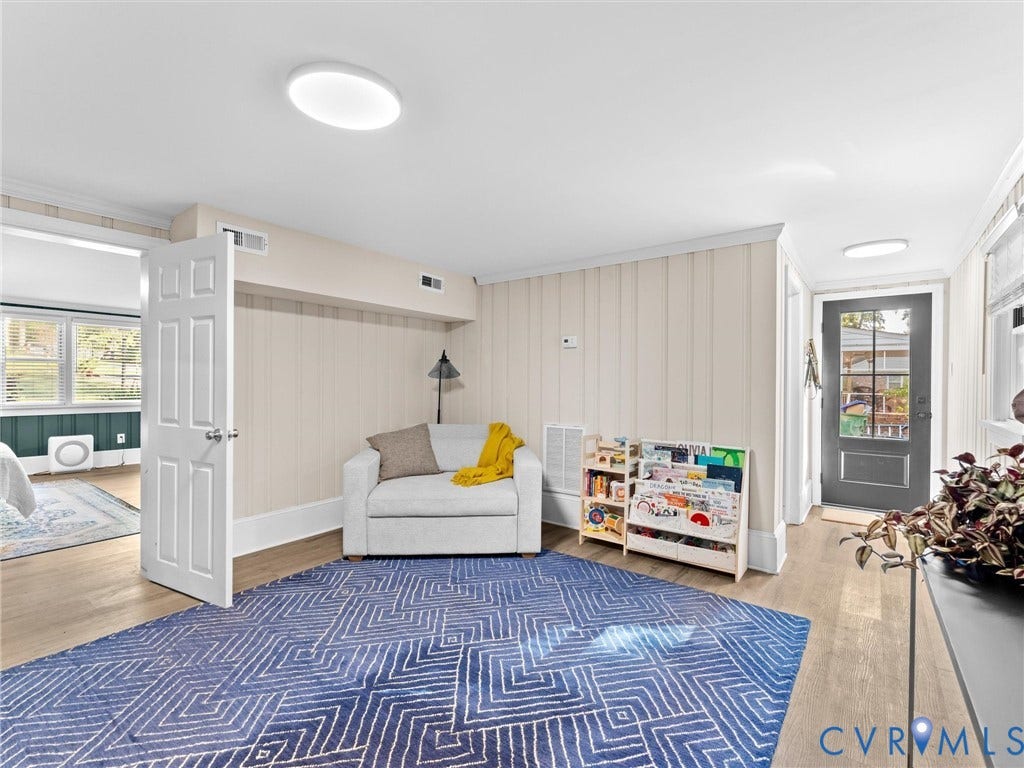 8341 Charlise Road, Stratford Hills, Midlothian, VA 23235 Neutral wall paneling, wood-finish flooring, and exterior door with glass insert