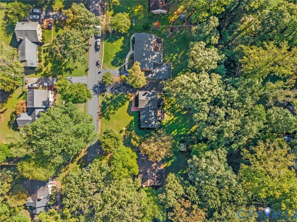 8341 Charlise Road, Stratford Hills, Midlothian, VA 23235 Aerial perspective of the lot featuring extensive mature tree coverage, an asphalt driveway, and a large grass lawn