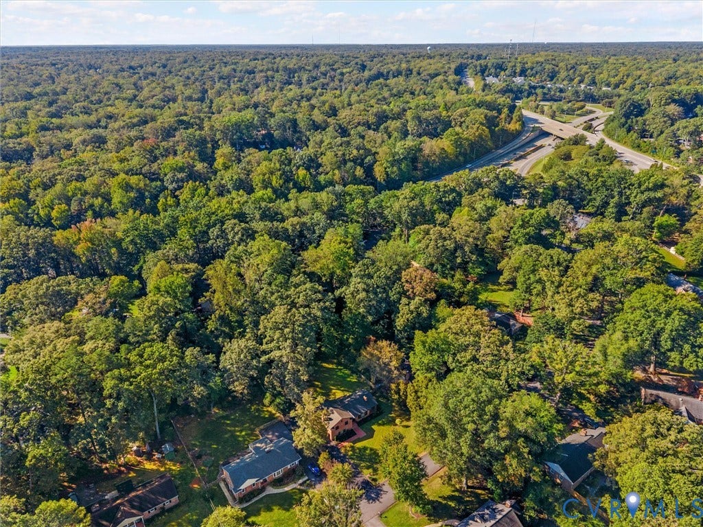 8341 Charlise Road, Stratford Hills, Midlothian, VA 23235 Aerial perspective featuring a residential lot surrounded by a dense canopy of mature trees and established woodland
