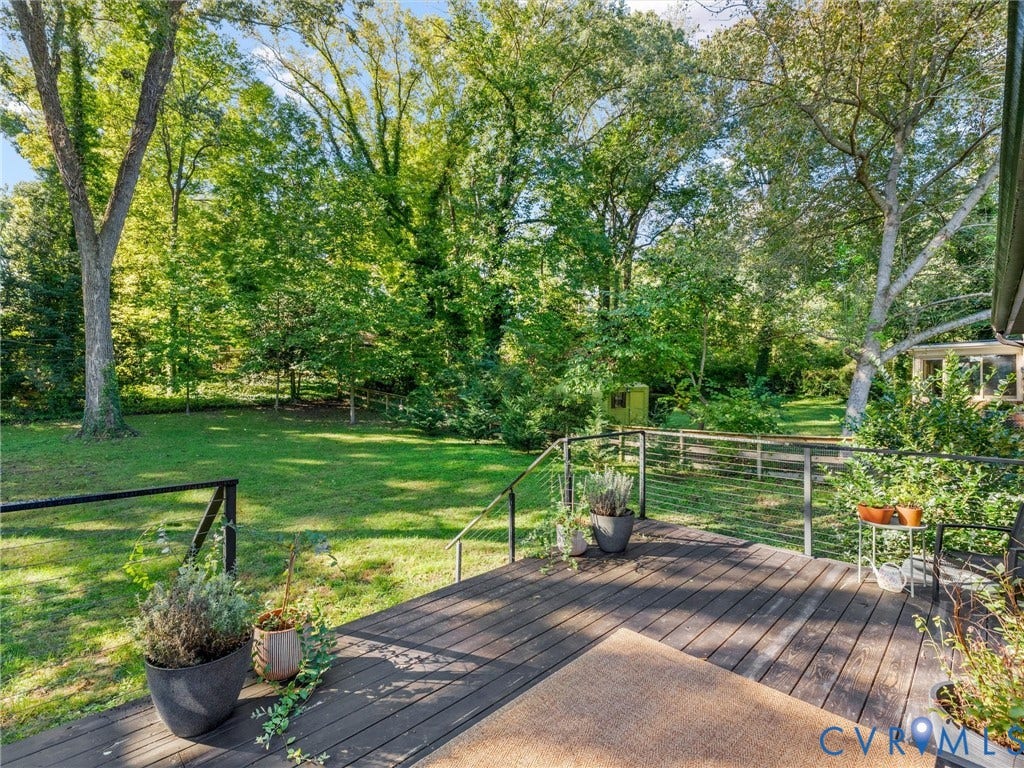 8341 Charlise Road, Stratford Hills, Midlothian, VA 23235 Raised deck featuring horizontal cable railing, wood-tone decking, and an expansive lawn with mature trees