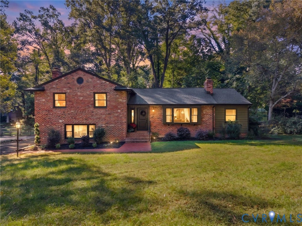 8341 Charlise Road, Stratford Hills, Midlothian, VA 23235 Brick and siding exterior featuring a multi-level roofline, prominent bay window, brick entryway, and mature tree-lined lot
