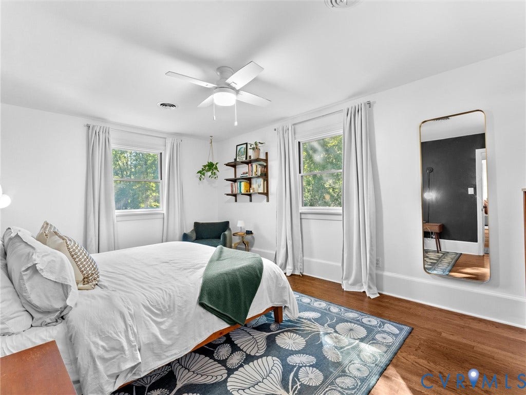 8341 Charlise Road, Stratford Hills, Midlothian, VA 23235 Wood-finish flooring, dual windows with white casing, and a central ceiling fan with integrated lighting