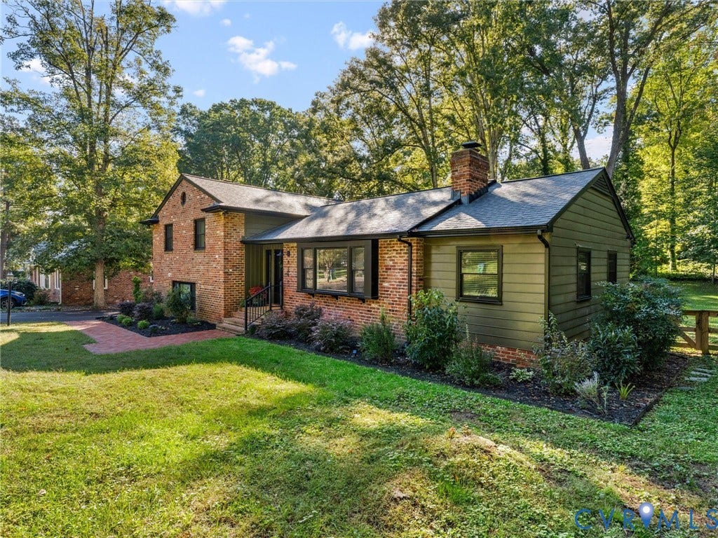 8341 Charlise Road, Stratford Hills, Midlothian, VA 23235 Exterior featuring a combination of brick and horizontal siding, a prominent brick chimney, a bay window, and a red brick walkway