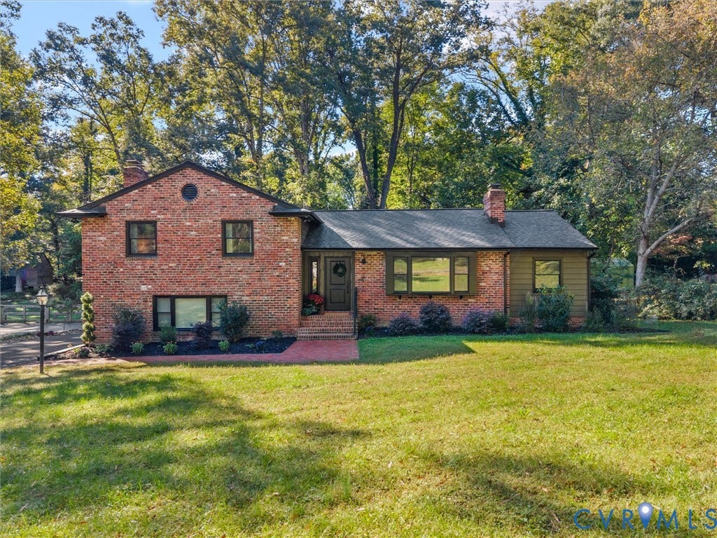 8341 Charlise Road, Stratford Hills, Midlothian, VA 23235 Multi-level brick exterior featuring a shingled roof, horizontal siding accents, an expansive front lawn, and mature trees