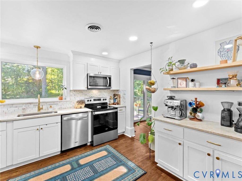 8341 Charlise Road, Stratford Hills, Midlothian, VA 23235 Kitchen featuring white cabinetry, wood-finish flooring, stainless steel appliances, light-toned countertops, and floating wood shelving