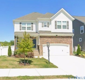 7051 Rivermere Lane, Glen Allen, VA 23059 Two-story residence featuring a brick and white siding facade, an integrated two-car garage, and a covered front entry