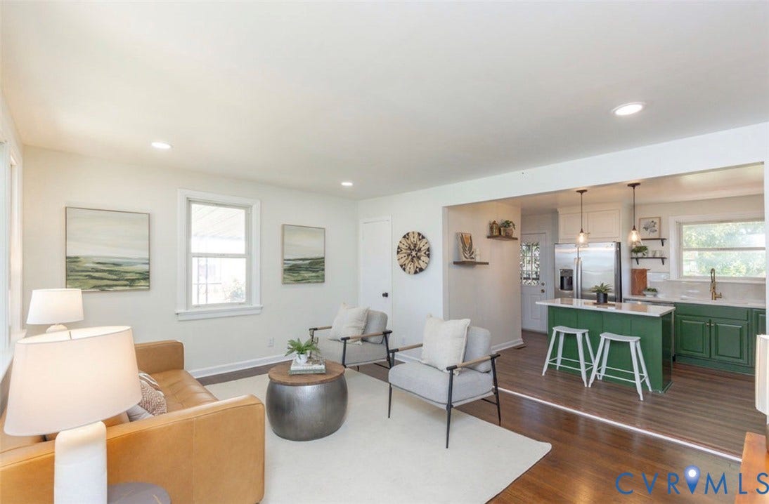 2211 Apollo Road, Fairfield, VA 23223 Hardwood-style flooring throughout, recessed lighting, kitchen island with seating, stainless steel appliances, and a gold-finish faucet