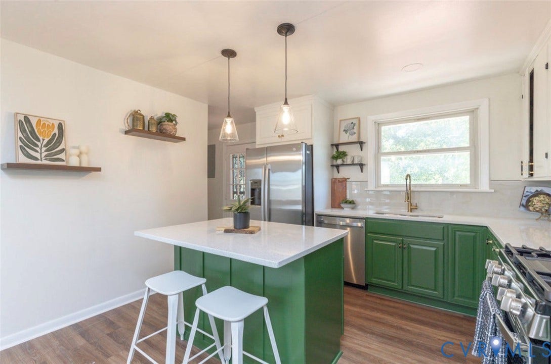 2211 Apollo Road, Fairfield, VA 23223 Kitchen featuring green lower cabinetry, a center island with pendant lighting, wood-finish flooring, white countertops, and a stainless steel appliance suite