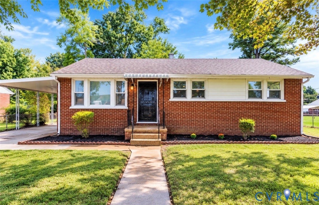 2211 Apollo Road, Fairfield, VA 23223 Brick facade, covered carport, front walkway, landscaped front yard, and front entry with storm door