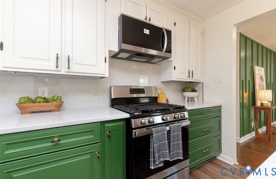 2211 Apollo Road, Fairfield, VA 23223 White upper cabinetry, green lower cabinetry, stainless steel range, built-in microwave, and white countertops
