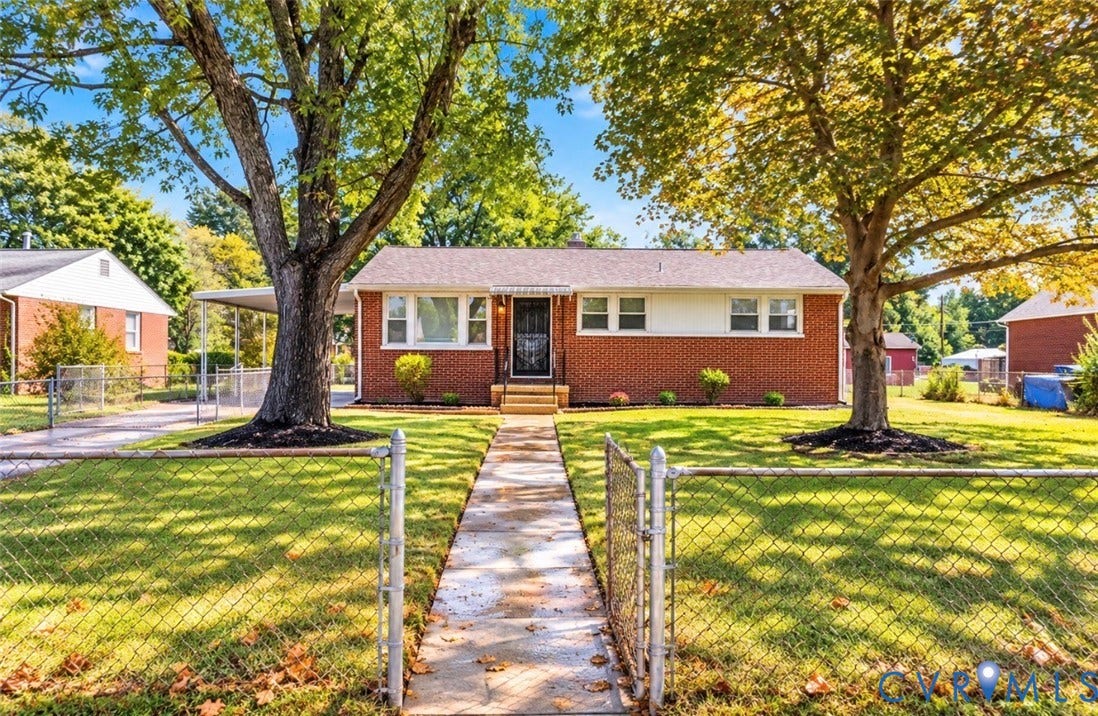 2211 Apollo Road, Fairfield, VA 23223 Brick exterior with a covered entryway and white trim