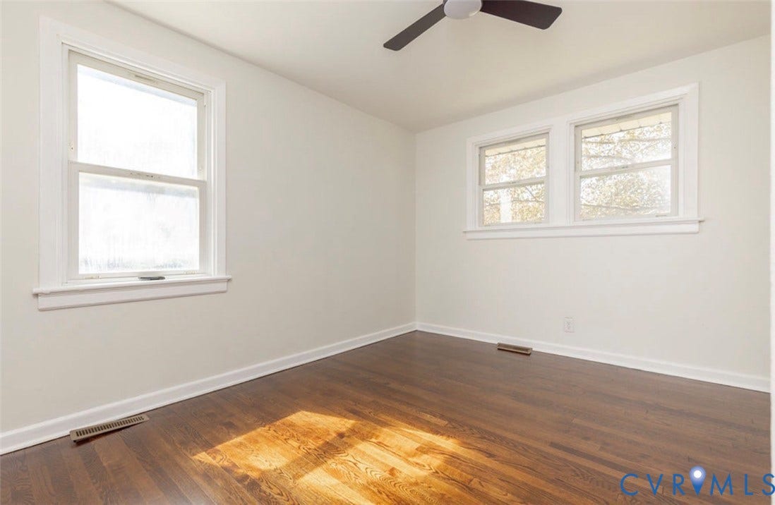 2211 Apollo Road, Fairfield, VA 23223 Wood-finish flooring, white walls, and white trim