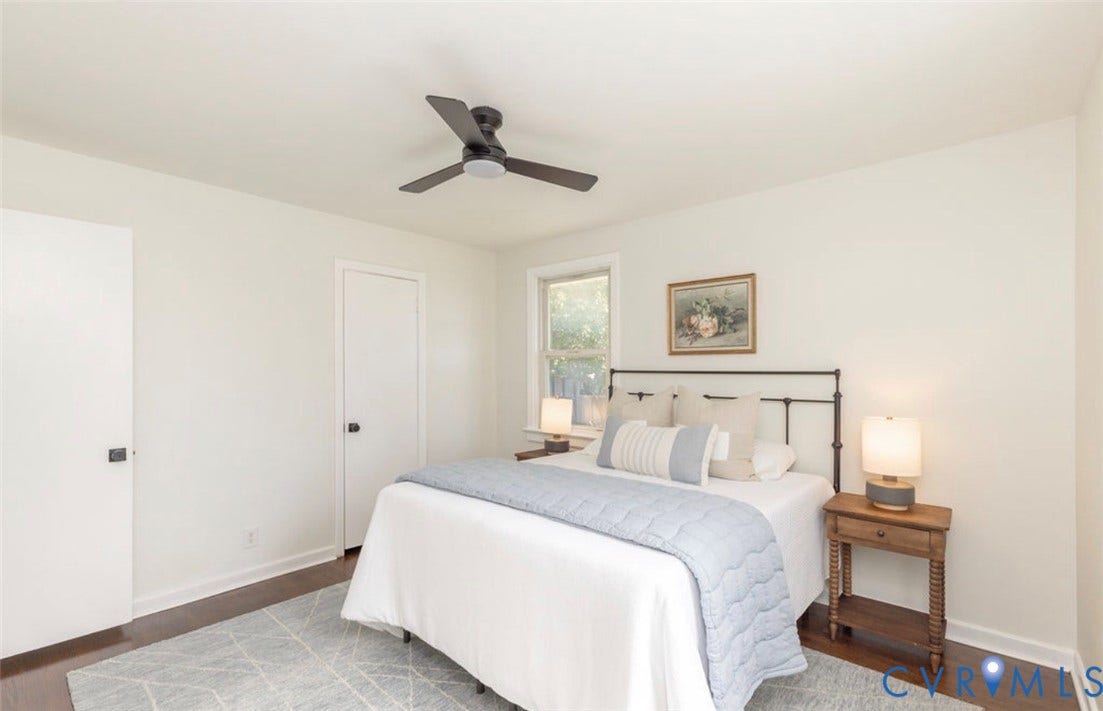 2211 Apollo Road, Fairfield, VA 23223 Hardwood-style flooring throughout, featuring a ceiling fan, window, and white doors with dark hardware