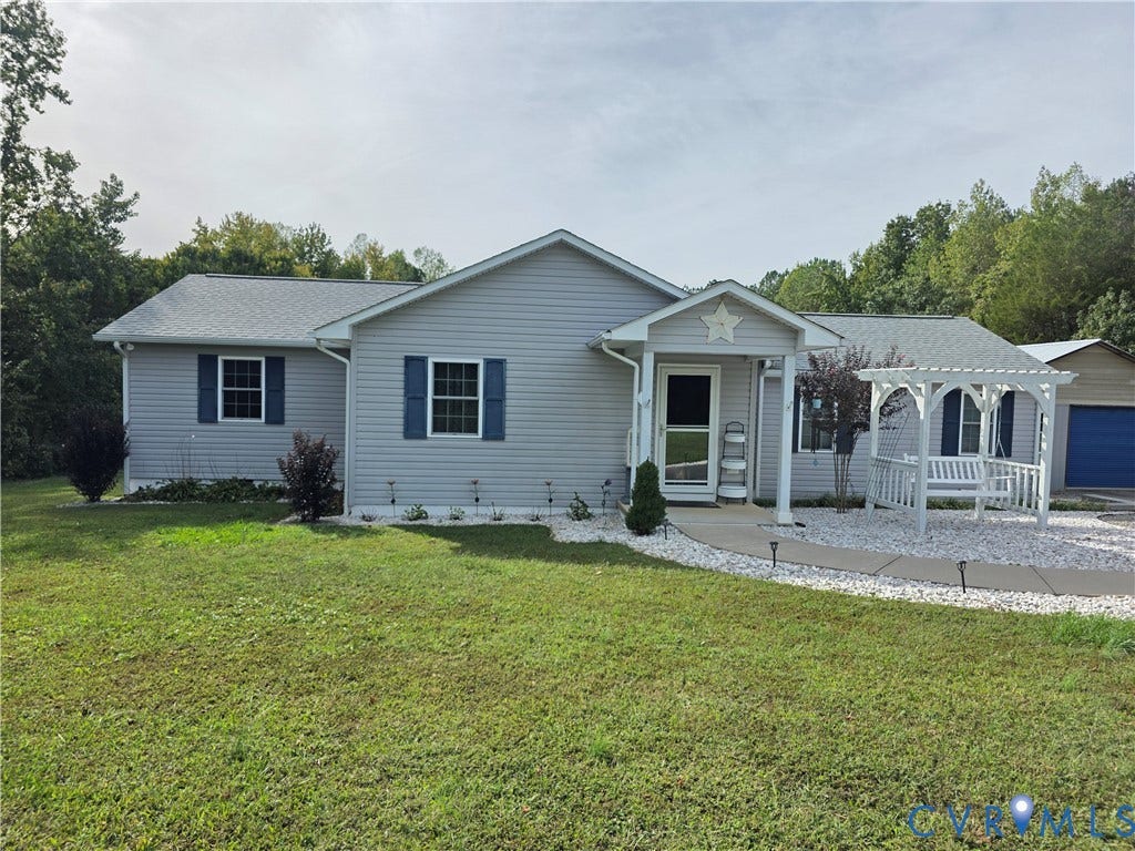 Light gray siding exterior with blue window shutters