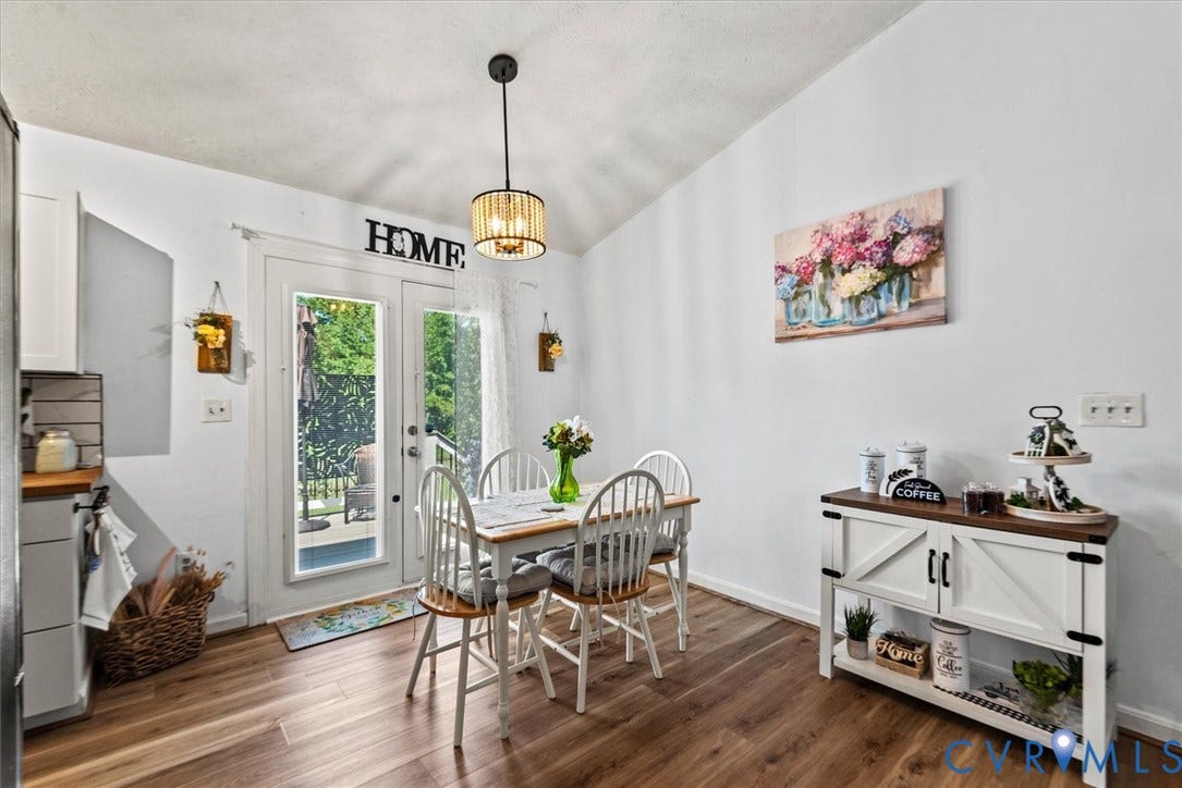 2421 Pittston Road, Ruffin's Pond, Fredericksburg, VA 22408 Wood-finish flooring, white walls, and a contemporary ceiling light fixture
