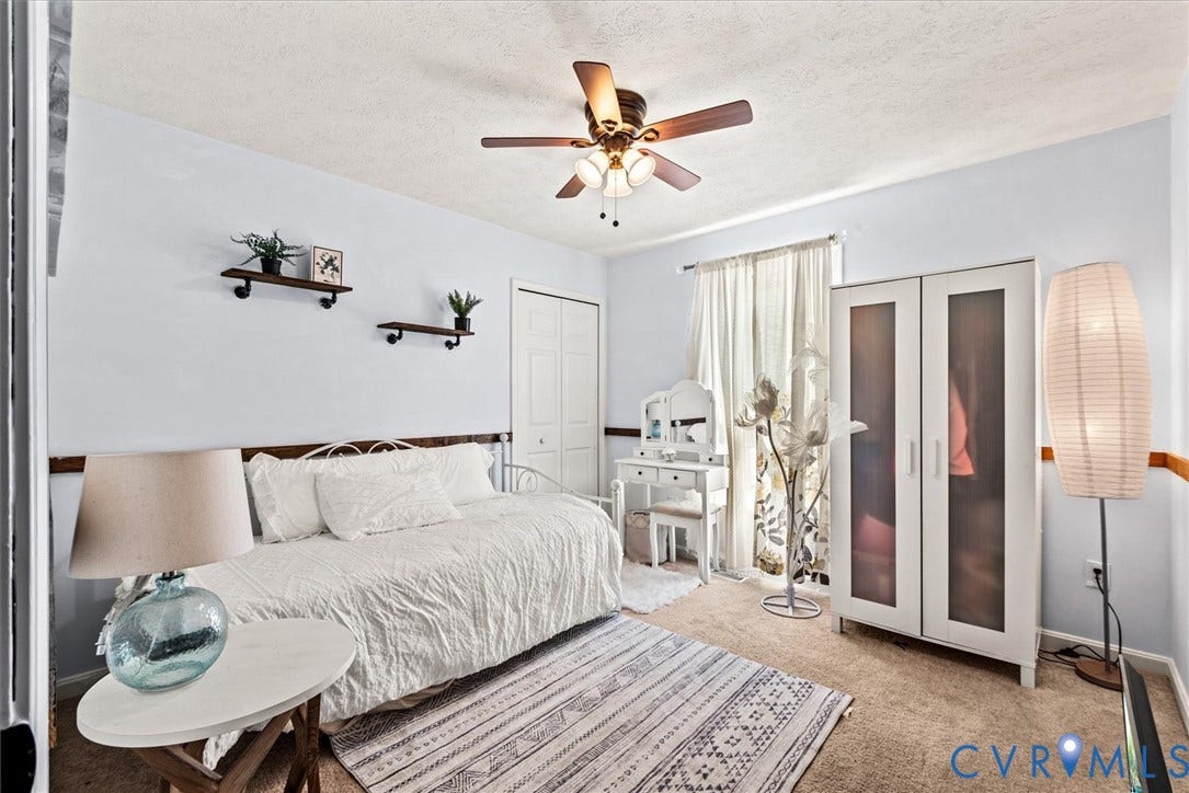 2421 Pittston Road, Ruffin's Pond, Fredericksburg, VA 22408 Wall-to-wall carpeting with light blue wall color, featuring a ceiling fan with integrated lighting, and a white bi-fold closet door