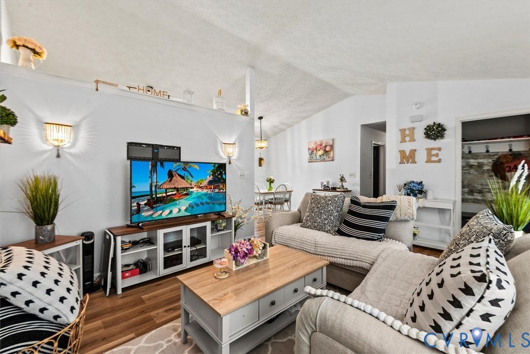 2421 Pittston Road, Ruffin's Pond, Fredericksburg, VA 22408 Vaulted ceiling, wood-finish flooring, two wall sconces, integrated media console, and built-in shelving