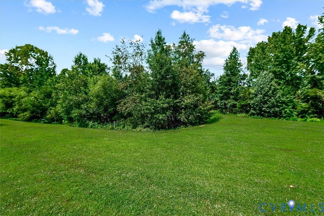 2421 Pittston Road, Ruffin's Pond, Fredericksburg, VA 22408 Expansive green lawn with a perimeter of mature deciduous and evergreen trees