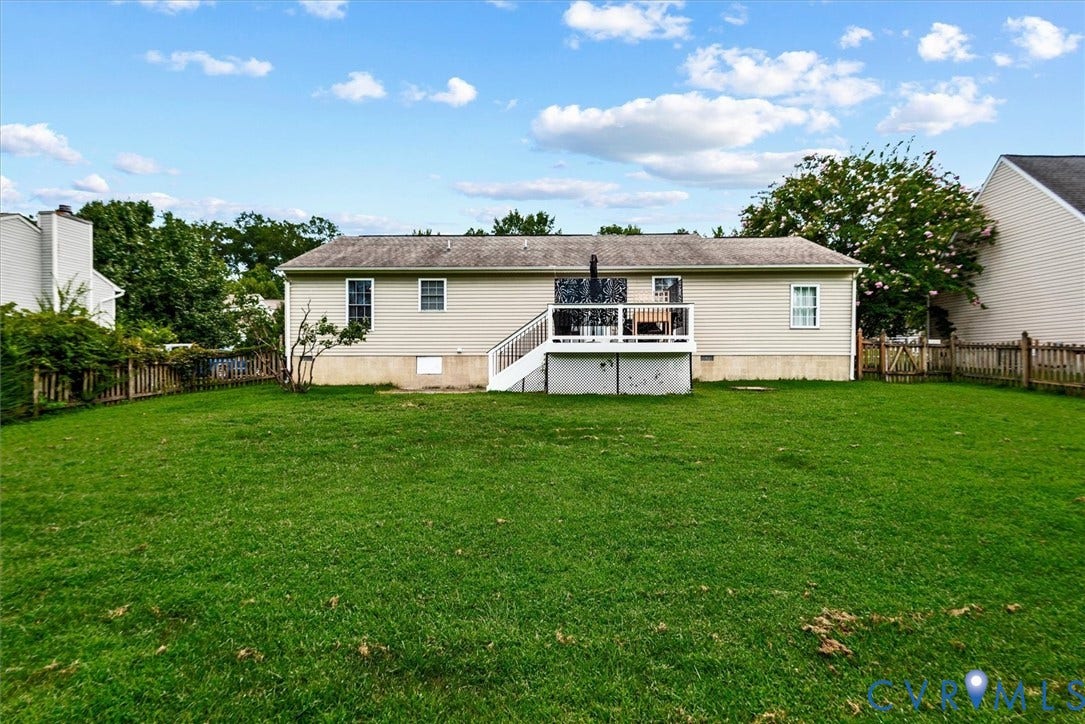 2421 Pittston Road, Ruffin's Pond, Fredericksburg, VA 22408 Expansive green lawn, wood fence perimeter, and a rear deck with staircase access