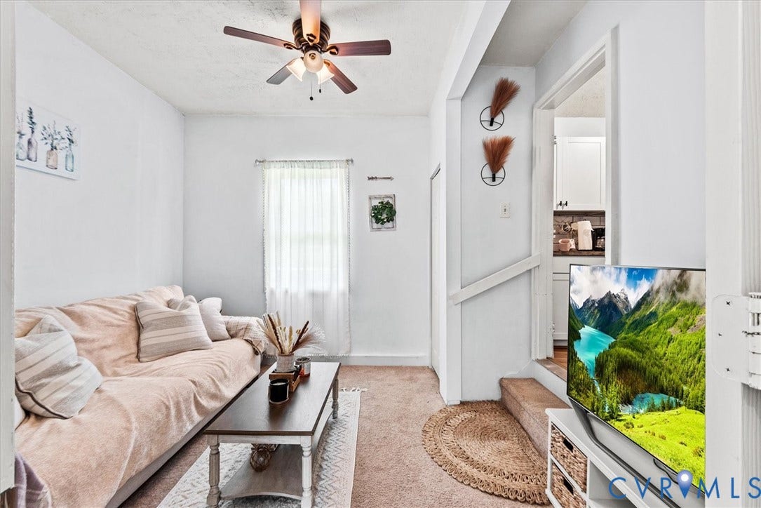 2421 Pittston Road, Ruffin's Pond, Fredericksburg, VA 22408 White interior walls with a ceiling fan, window with sheer curtain, and carpeted flooring