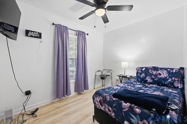 4647 Twelveoaks Road, Midlothian, VA 23112 Room featuring wood-finish flooring, a ceiling fan with integrated lighting, and a multi-pane window