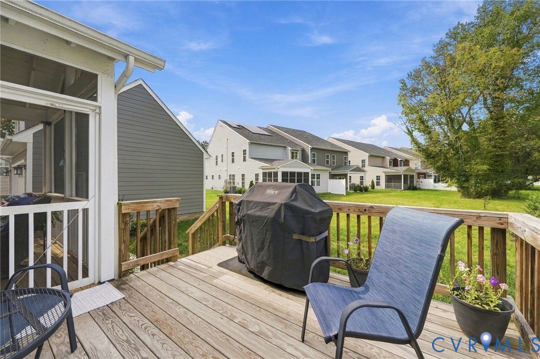 Outdoor wooden deck with railing, providing exterior access