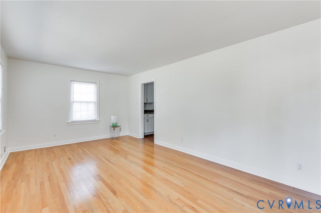 1701 Kingswood Street, Richmond, VA 23224 Room with light-toned wood-finish flooring, neutral walls, and a single-hung window