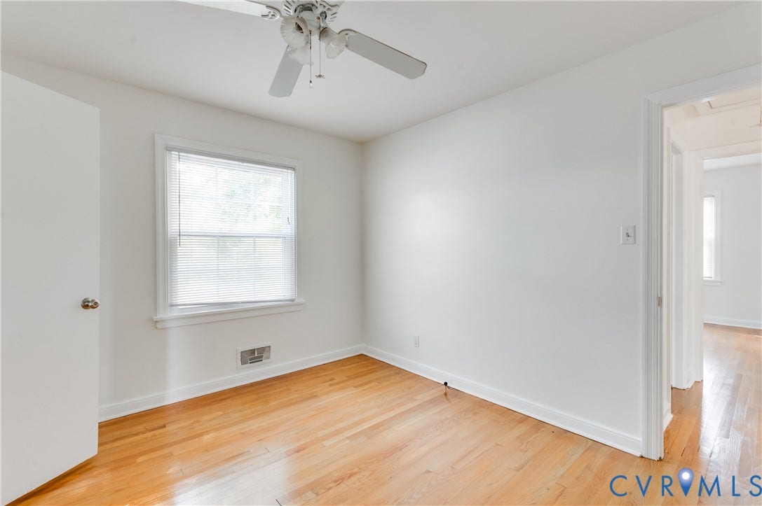 1701 Kingswood Street, Richmond, VA 23224 Wood-finish flooring, multi-pane window, ceiling fan with integrated light fixture, and solid-core interior door