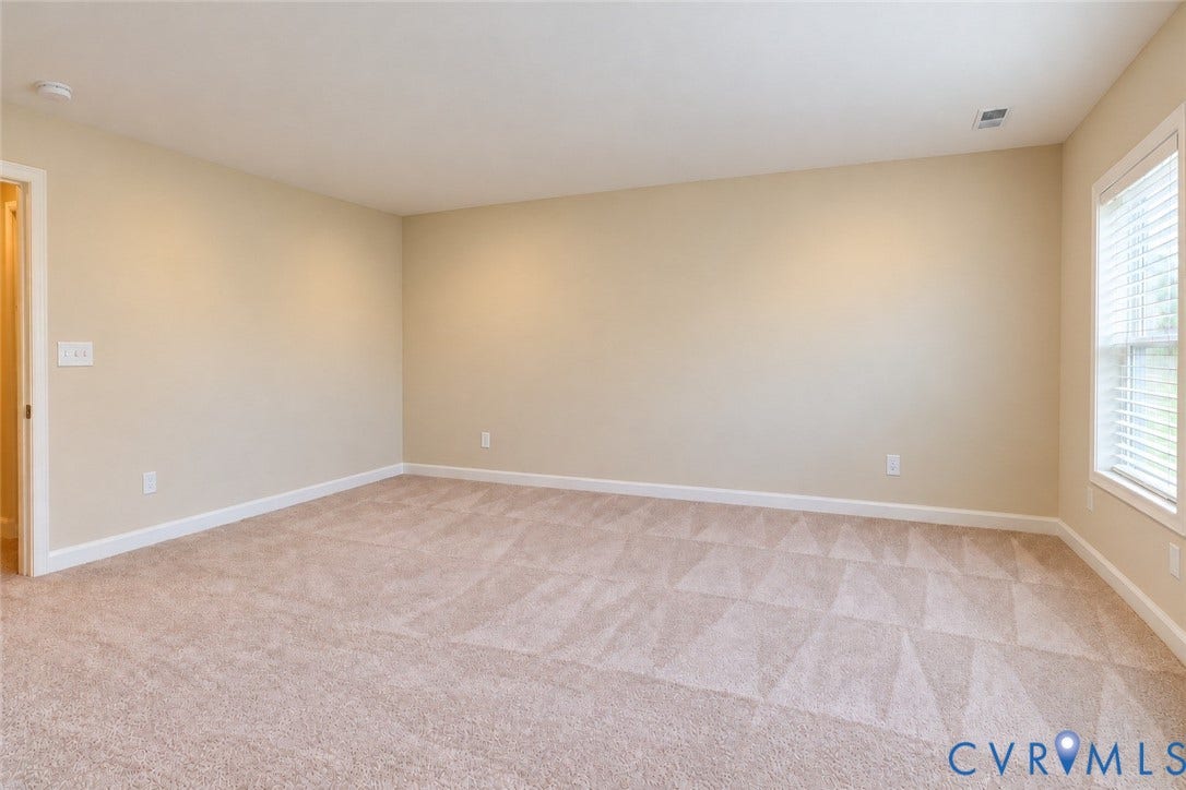 10507 Benoni Trail, Glen Allen, VA 23059 Neutral-toned walls and plush carpeting with a geometric pattern