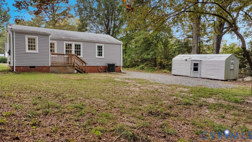 4130 Sprenkle Lane, Wistar Heights, Henrico, VA 23228 Light gray siding exterior with a wood deck and stairs