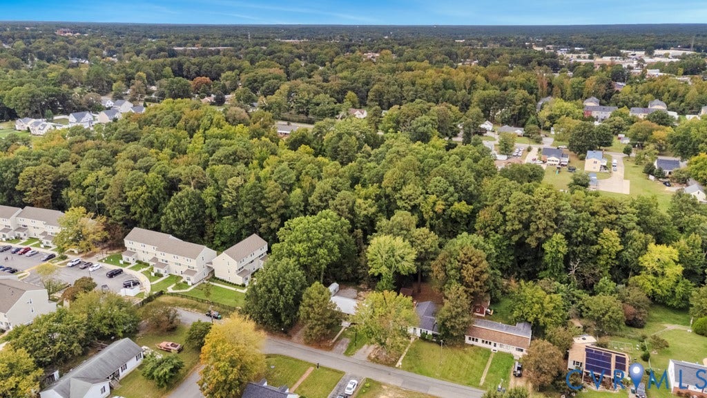 4130 Sprenkle Lane, Wistar Heights, Henrico, VA 23228 Expansive treed landscape with residential structures and paved parking areas