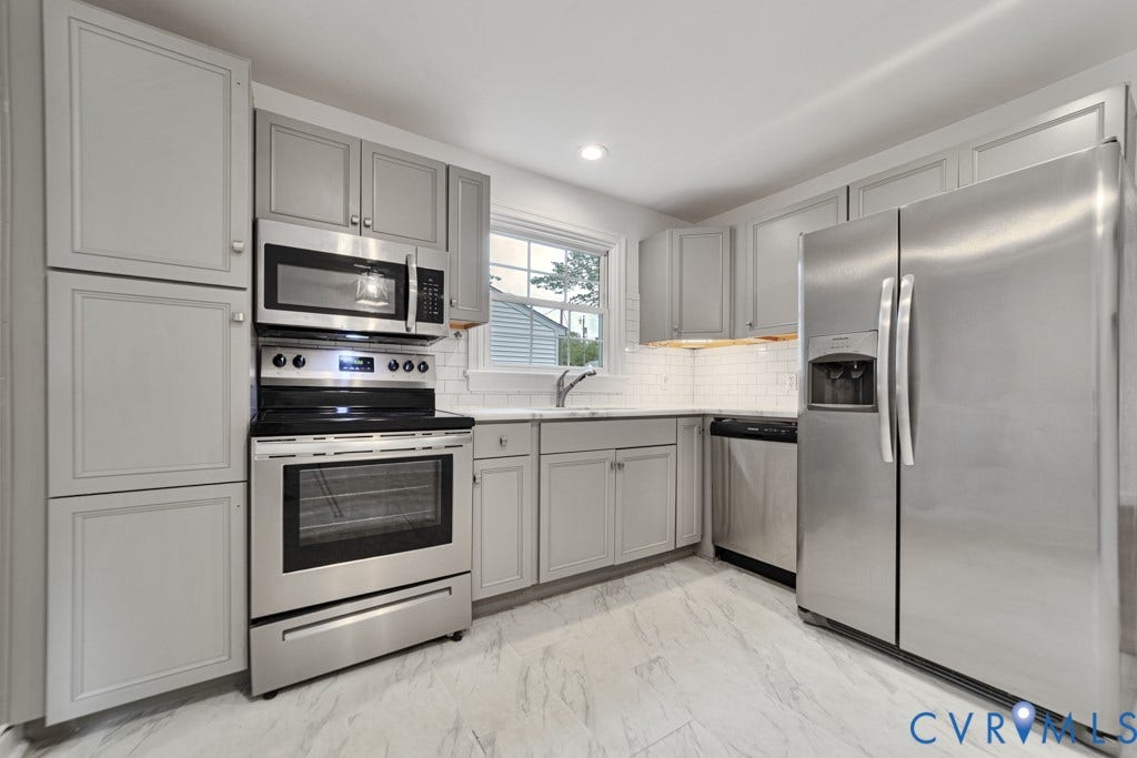 4130 Sprenkle Lane, Wistar Heights, Henrico, VA 23228 Light gray cabinetry, stainless steel appliances, white subway tile backsplash, white countertop, and tiled flooring