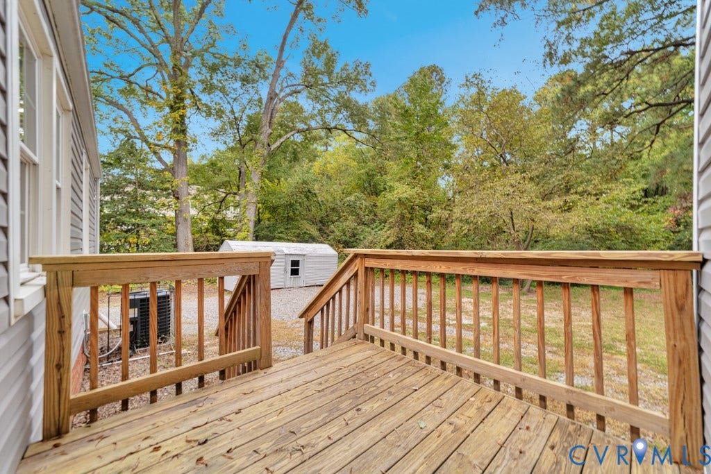 4130 Sprenkle Lane, Wistar Heights, Henrico, VA 23228 Wood deck with natural finish, wood railings, and stairs leading to a gravel area