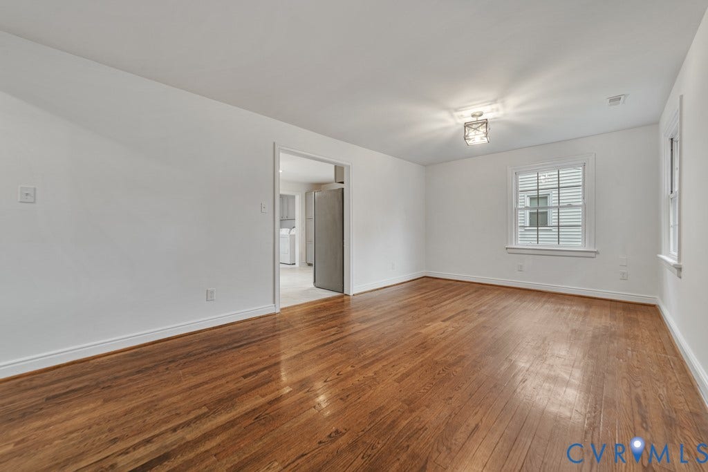 4130 Sprenkle Lane, Wistar Heights, Henrico, VA 23228 Hardwood flooring, white wall paint, flush mount ceiling light, and window with white trim