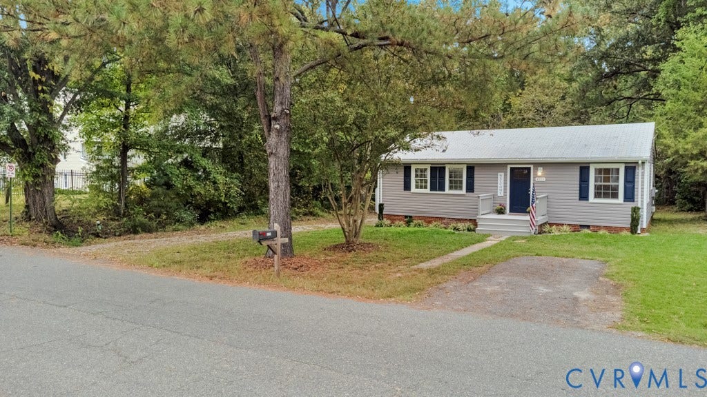 4130 Sprenkle Lane, Wistar Heights, Henrico, VA 23228 Ranch-style residence featuring light gray siding, dark blue window shutters, and a matching dark blue front door