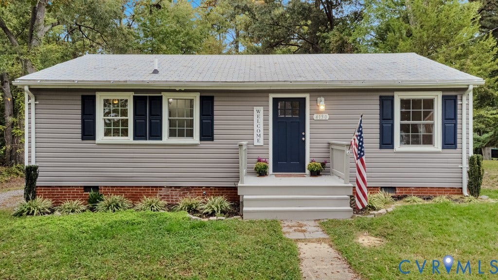 4130 Sprenkle Lane, Wistar Heights, Henrico, VA 23228 Vinyl siding exterior with a shingle roof, brick foundation, and dark blue front door