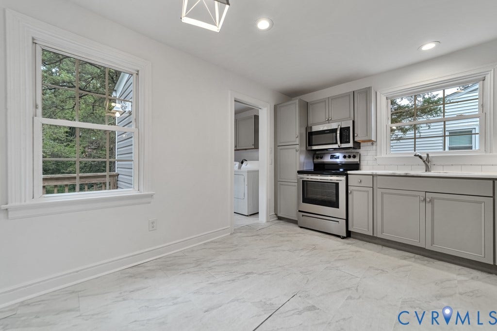 4130 Sprenkle Lane, Wistar Heights, Henrico, VA 23228 Kitchen featuring stainless steel appliances, light gray cabinetry, white subway tile backsplash, and light-toned tile flooring