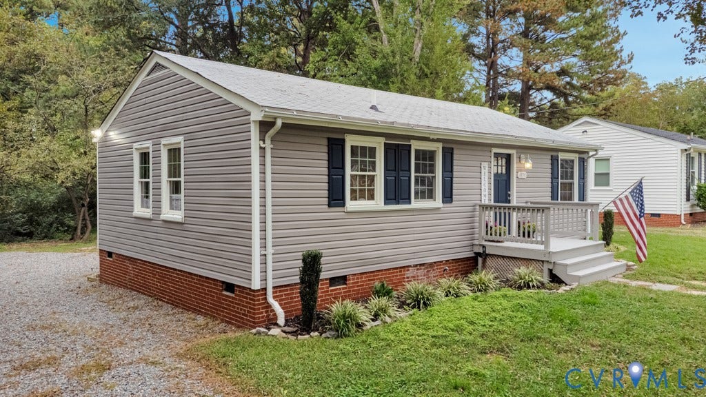 4130 Sprenkle Lane, Wistar Heights, Henrico, VA 23228 Gray siding exterior with white window trim, dark blue shutters, a front porch with railing, and brick foundation