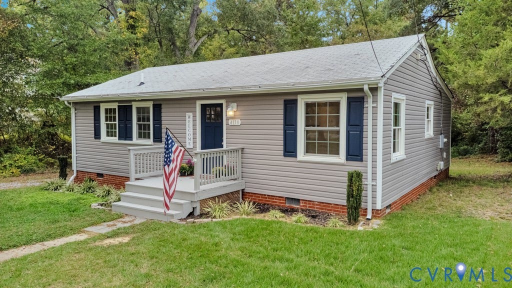 4130 Sprenkle Lane, Wistar Heights, Henrico, VA 23228 Light gray siding exterior with dark blue window shutters, white trim windows, and a dark blue front door