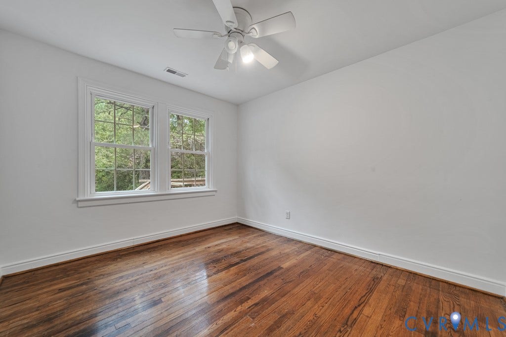 4130 Sprenkle Lane, Wistar Heights, Henrico, VA 23228 Hardwood flooring, white walls, double windows, ceiling fan with integrated lighting, and white trim
