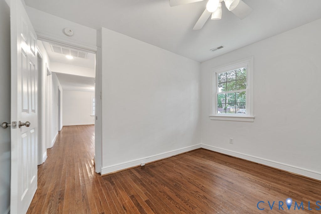 4130 Sprenkle Lane, Wistar Heights, Henrico, VA 23228 Hardwood flooring throughout, white painted walls, and a ceiling fan