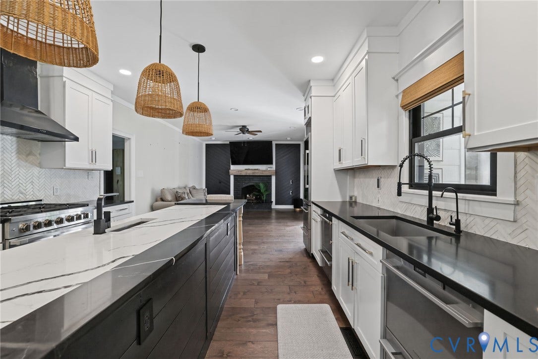 Kitchen Island and sink that overlooks the Screen-in Porch