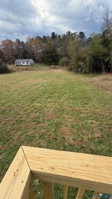 Expansive grassy yard with mature trees