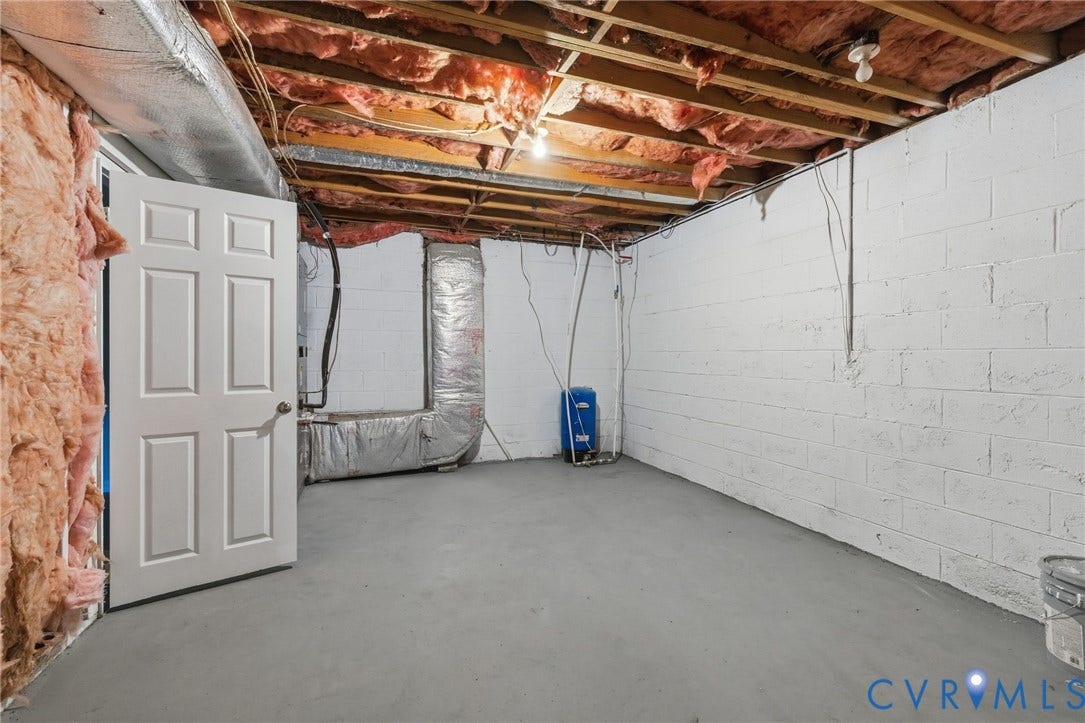10731 Spring Run Road, Manchester, Chesterfield, VA 23832 Concrete block walls, exposed wood ceiling joists, concrete flooring, and metal ductwork